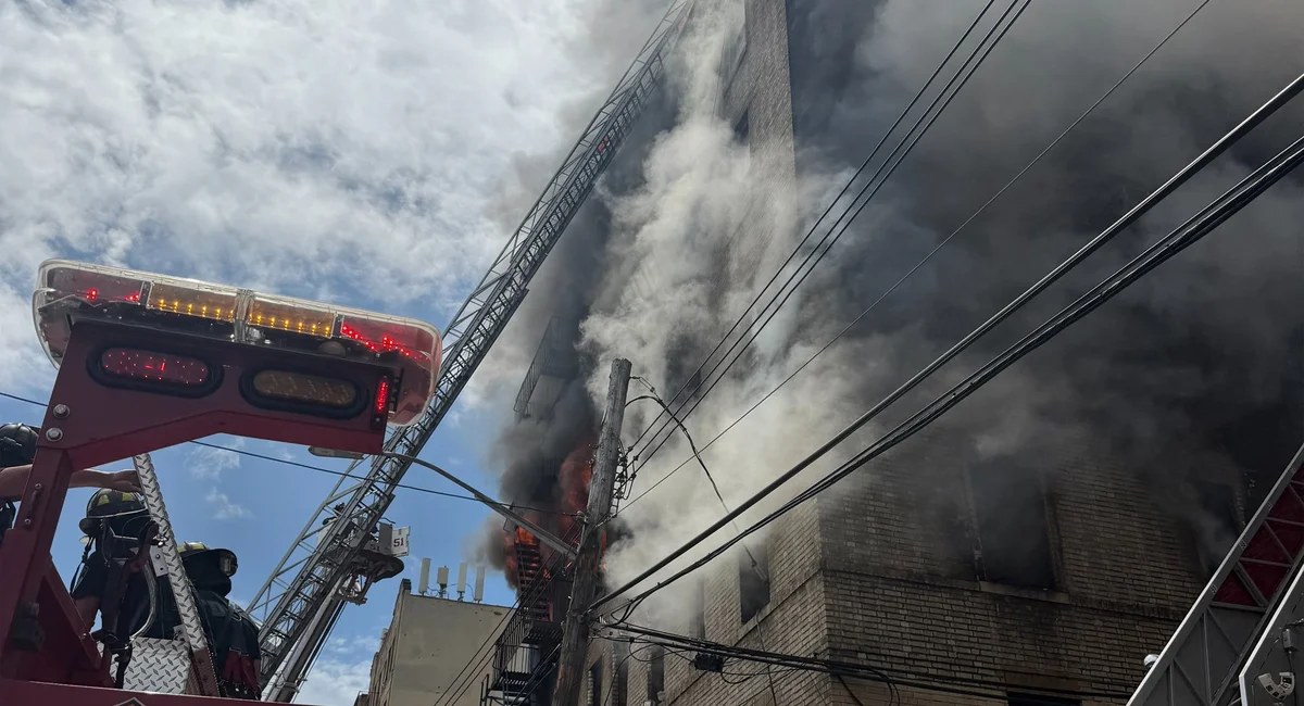 A third body is pulled from the Norwood fire
